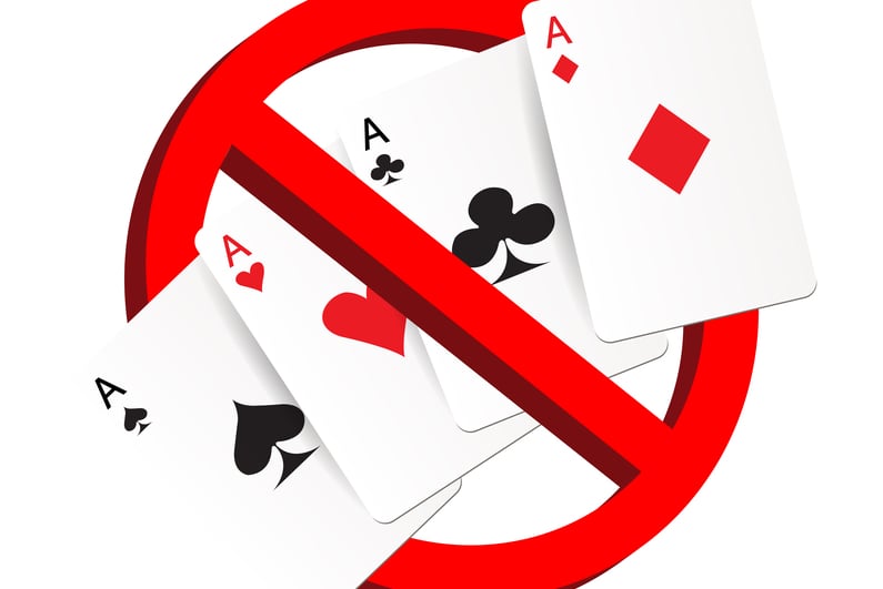 Playing cards and a no entry sign