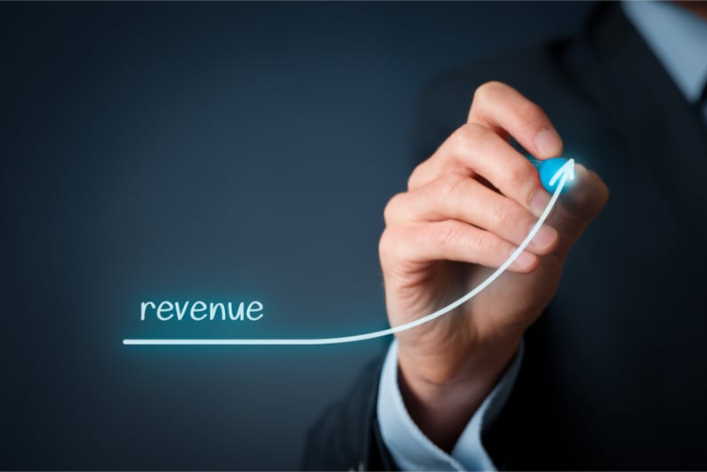 Businesman with revenue graph