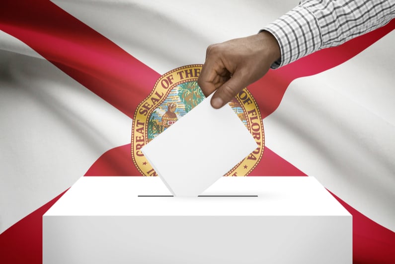 Ballot box with Florida state flag in background