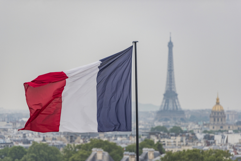 French flag with Eiffel Tower in background